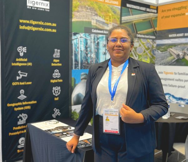Tigernix Sales and Marketing Manager posing at the Indowater Booth (J09)